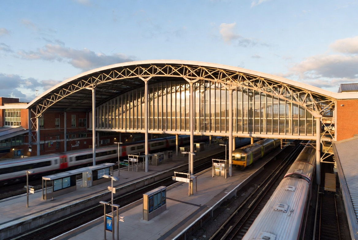 Modern UK railway station with trains